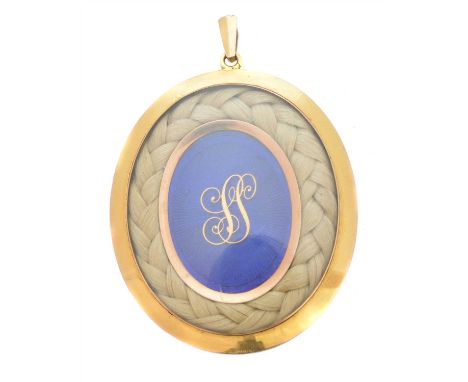 A Victorian enamel and hairwork mourning pendant, of oval form, the blue enamel panel with central monogram, within a hairwor