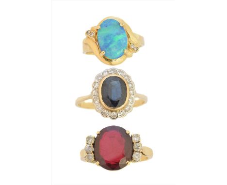 Three gem-set dress rings, to include a sapphire and diamond cluster ring, an opal and diamond dress ring and a synthetic rub