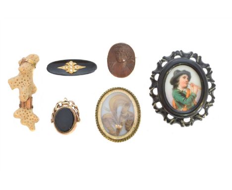A selection of jewellery, to include a late 19th century lava cameo brooch, a Victorian hairwork jewellery component, a jet a