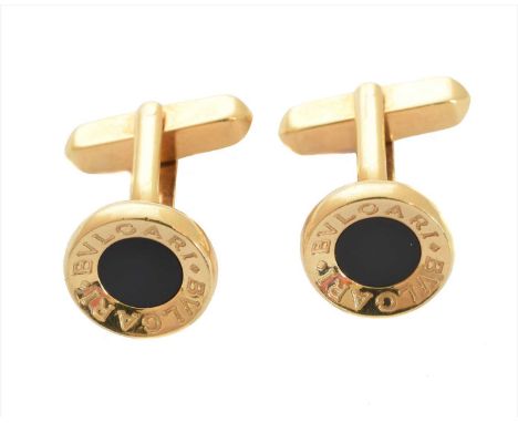 A pair of 18ct gold onyx cufflinks by Bulgari, each designed as an onyx disc with 'BVLGARI' text surround, with toggle back, 