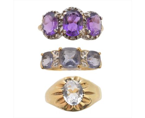 Three 9ct gold gem set rings, to include an amethyst and diamond cluster ring, an iolite and diamond three stone ring and a c