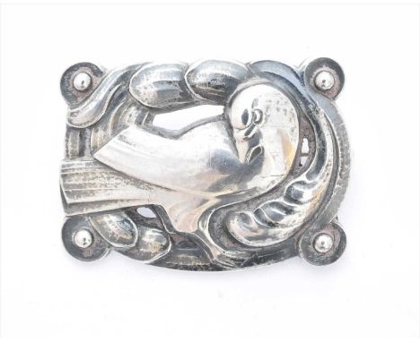 An early 20th century silver Georg Jensen brooch, no. 209, designed as a dove within a scrolling surround, maker's marks for 