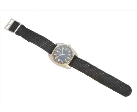 A stainless steel CWC military wristwatch, the circular black signed dial with Arabic hour markers, luminscent dot markers an