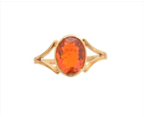 A 9ct fire opal single stone ring, the oval shape fire opal with tapered shoulders, hallmarks for Birmingham, ring size N1/2,