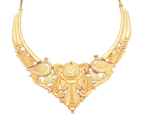 A necklace, of openwork design the central scrolling motif with peacock colourless gem hinged surround and flat curb link cha