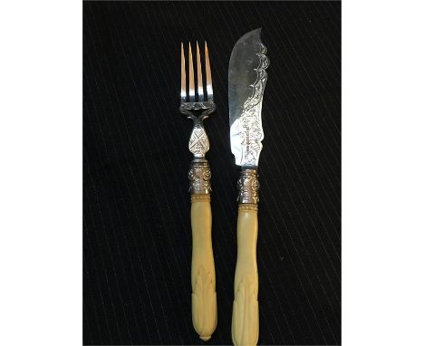 A silver fish knife and fork hallmarked Birmingham 1870