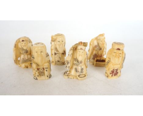 SIX CARVED BONE NETSUKE
of merchants, all approximately 5.5cm high 