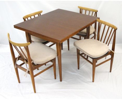 RETRO MAHOGANY DRAW LEAF DINING TABLE
standing on tapering turned supports, together with four stick back chairs with stuffov