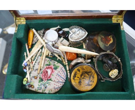A large collection of bobbins, a purse, a portrait miniature, compass, enamel salt, pill box, caddy spoon and sundry curios