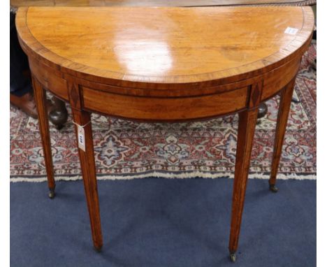 A George III satinwood and rosewood banded demi lune card table, W.92cm, D.55cm, H.76cm