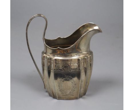 A George III Irish silver helmet shaped cream jug by Gustavus Byrne, Dublin, 1801, 13.3cm, 4.5 oz.CONDITION: Tiny split to ea