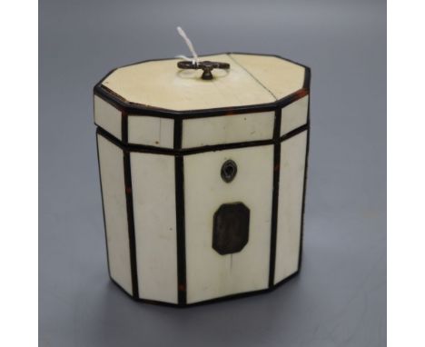 A George III octagonal ivory and tortoiseshell veneered tea caddy, height 10cm