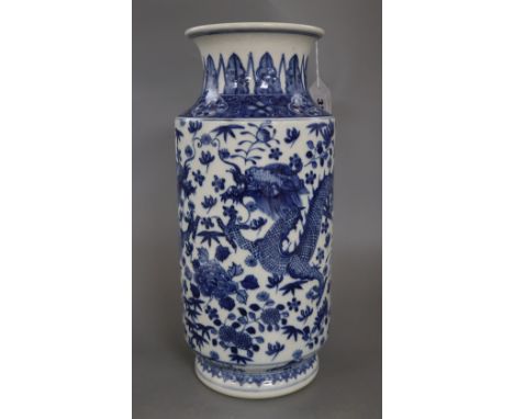 A large Chinese blue and white cylindrical dragon vase, with Kangxi mark, height 37cmCONDITION: An area of scratching to the 