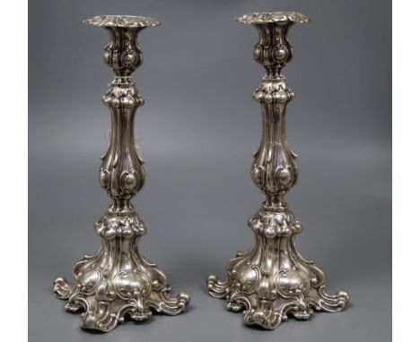 A pair of early 20th century Austro Hungarian 800 standard white metal candlesticks, maker WD, height 30.3cm, 15oz.CONDITION: