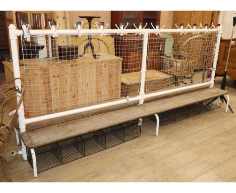 A vintage cast iron double school changing room bench, with wood seats, W.300cm D.62cm H.130cm