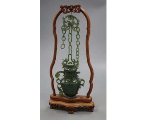 A jade vase on stand