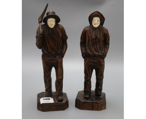 Two carved wood figures of workmen, with ivory faces, signed Neri, height 31cm