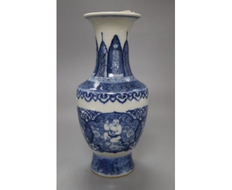 A Chinese blue and white bottle vase, bears Kangxi mark, height 22cmCONDITION: Some discolouration / browning to the interior