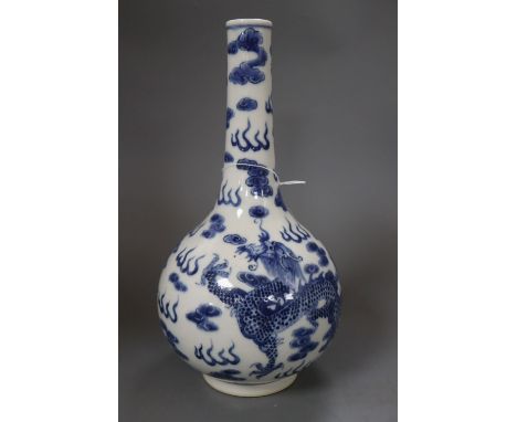 A Chinese blue and white dragon bottle vase, with Kangxi mark, height 32cmCONDITION: Typical minor flaws in the manufacture s