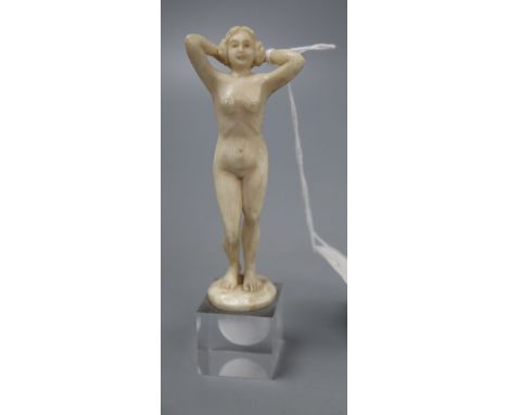 An Art Deco ivory carving of a female nude, unsigned, height 12cm