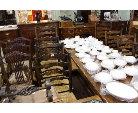 Set of eight rush seated ladder back dining chairs including two carvers