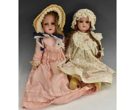 Dolls - a German Metzier bisque socket head doll, sleeping blue eyes, open mouth. light brown curly wig, on jointed compositi