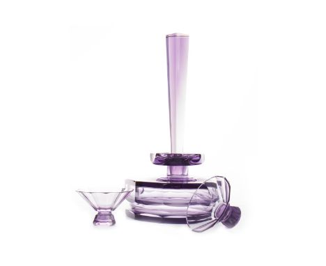 ART DECO AMETHYST GLASS DECANTER AND TWO GLASSES, of Czechoslovakian origin, mark to base, the decanter 31cm high