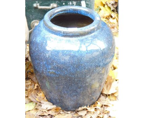 A blue glazed planter, 52cm high, 26cm wide.