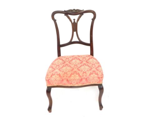 An Edwardian mahogany bedroom chair, with a harp and floral back, on pink upholstered seat.