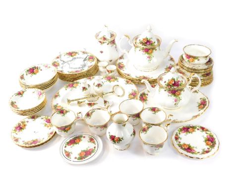 A Royal Albert Old Country Roses part tea service, comprising two tea pots, sugar bowl, jar and cover, five cups and saucers,