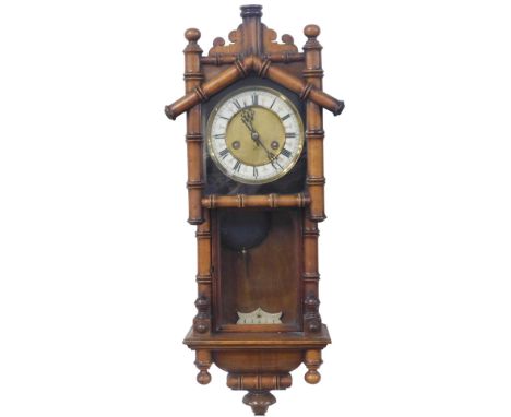 A 19thC walnut wall clock, of simulated bamboo form, with a gilt and cream Roman numeric dial, thirty hour movement with cros