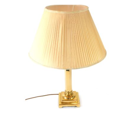 A late 20thC brass column table lamp, with cream shade, 61cm high.