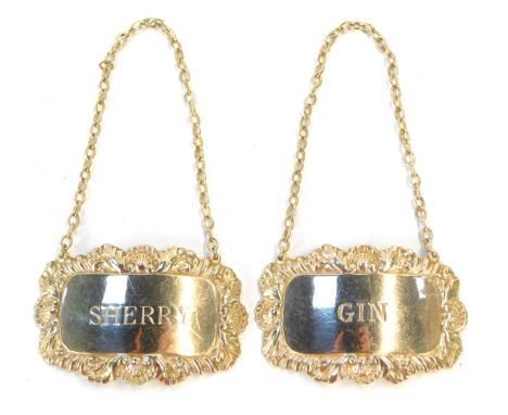 Two Elizabeth II silver decanter labels, each with shell capped boarder for Gin and Sherry, Birmingham 1957 and 1972, ¾oz.