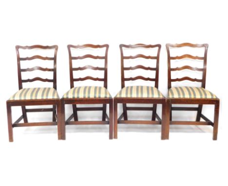 A set of four George III mahogany dining chairs, each with ladder rack, and a H stretcher base, 94cm high. 