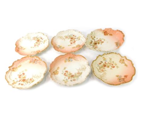 A Limoges French porcelain dessert service, with fluted and scroll design borders, a pink and cream ground with flowers, comp