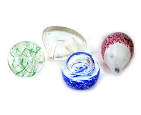 Four glass paperweights, comprising Wedgwood crystal kingfisher, Langham green swirl, Wedgwood red glass hedgehog, and a Cait