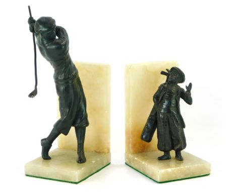 Two onyx and spelter golfer book ends, comprising gentleman in swinging pose, and child caddy, 25cm and 19cm high, (AF). (2)