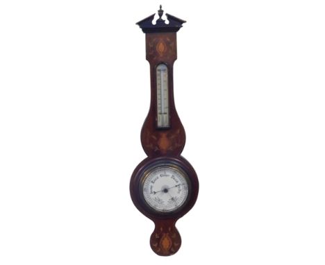 An Edwardian mahogany inlaid aneroid barometer, 73cm high. (AF)