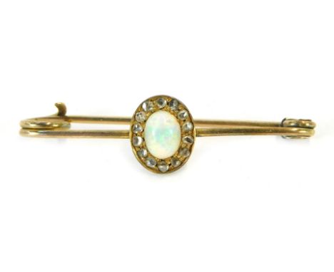 A 9ct gold bar brooch, with central opal and diamond chips, 4.5cm wide, 2.1g all in 