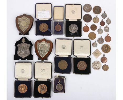 Hampshire Regiment Sports Medals and Trophies: A large quantity of mixed period medals to include seven hallmarked silver med