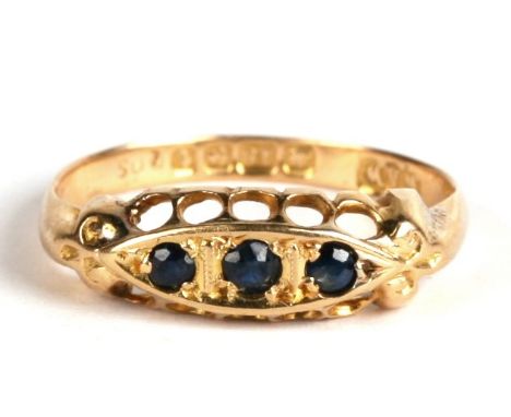 An 18ct gold and sapphire three stone ring, Birmingham 1918, 1.8g. Approx. UK size K. 