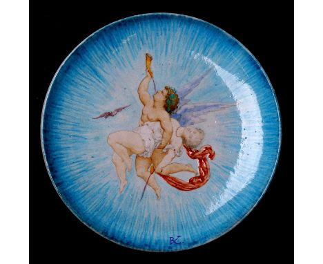 A Theodore Deck ceramic dish decorated with an angel and maiden, initialled 'TD' and numbered 1861 to underside, 29cms (11.5i