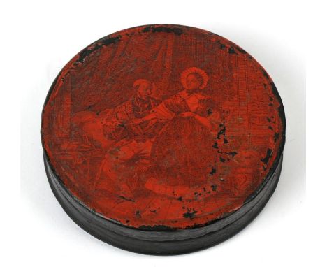 A 19th century circular papier mache snuff box, monochrome decorated with a scene of a courting couple, 8.5cm (3.25 ins) diam