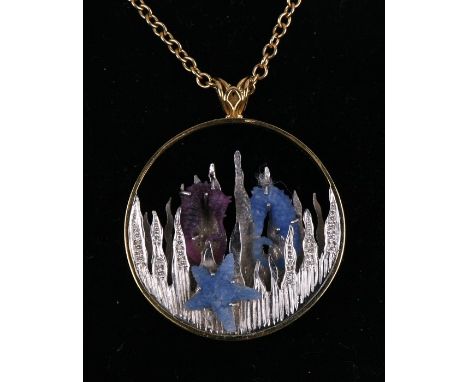 An 18ct yellow and white gold seascape pendent with carved blue sapphire seahorse and starfish and carved ruby seahorse set w
