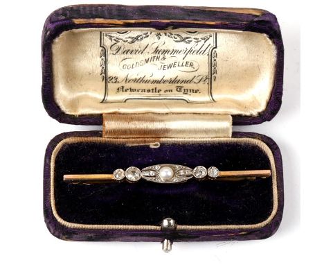A Gold and platinum bar brooch set central pearl and old cut diamonds. 3.5g. 5.7cm (2.25 ins) wide
