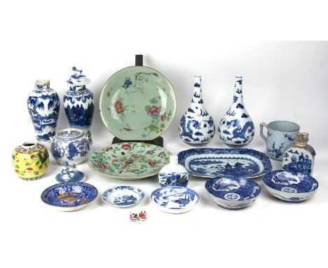A pair of Chinese blue and white bottle vases decorated dragons chasing a flaming pearl with four character mark to the under