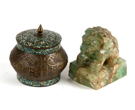 A jade or hardstone fo dog, 9cms (3.5ins) high; together with a Persian brass lidded box, 9cms (3.5ins) high (2).