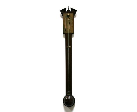 A mahogany cased stick barometer with brass face, fitted with a thermometer. Broken architectural pediment with brass finial 