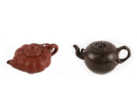 Two Chinese Yixing teapots, one of compressed pumpkin form, 9cms (3.5ins) diameter the other of globular form with branch han