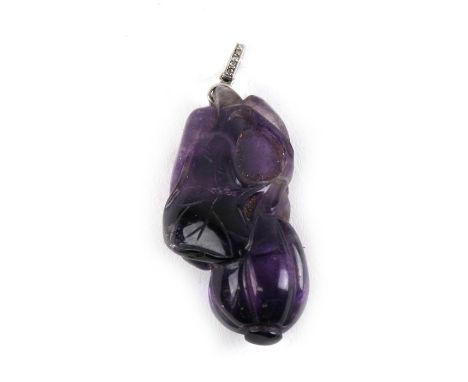 An antique Chinese carved amethyst pendant in the form of a gourd, with a diamond set suspension loop, 4cms (1.5ins) high.